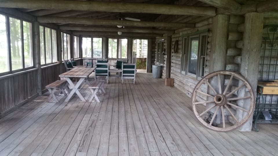 HUGE FRONT SCREENED IN PORCH WITH PICNIC TABLE. FANTASTIC VIEW EAST AND NORTH. 