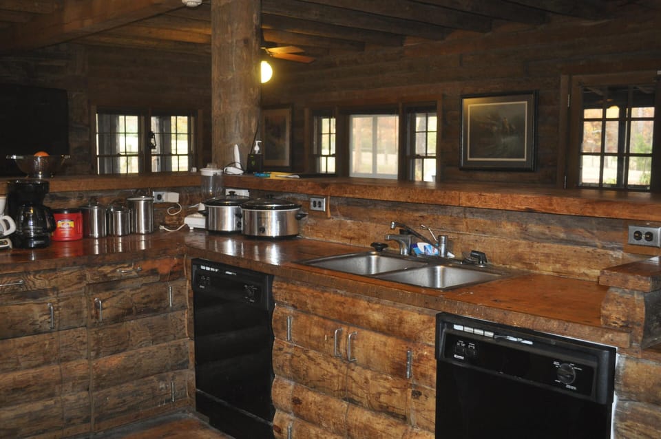 TWO DISHWASHERS.  TWO CROCKPOTS, OVERLOOKS FAMILY ROOM, DINING TABLE