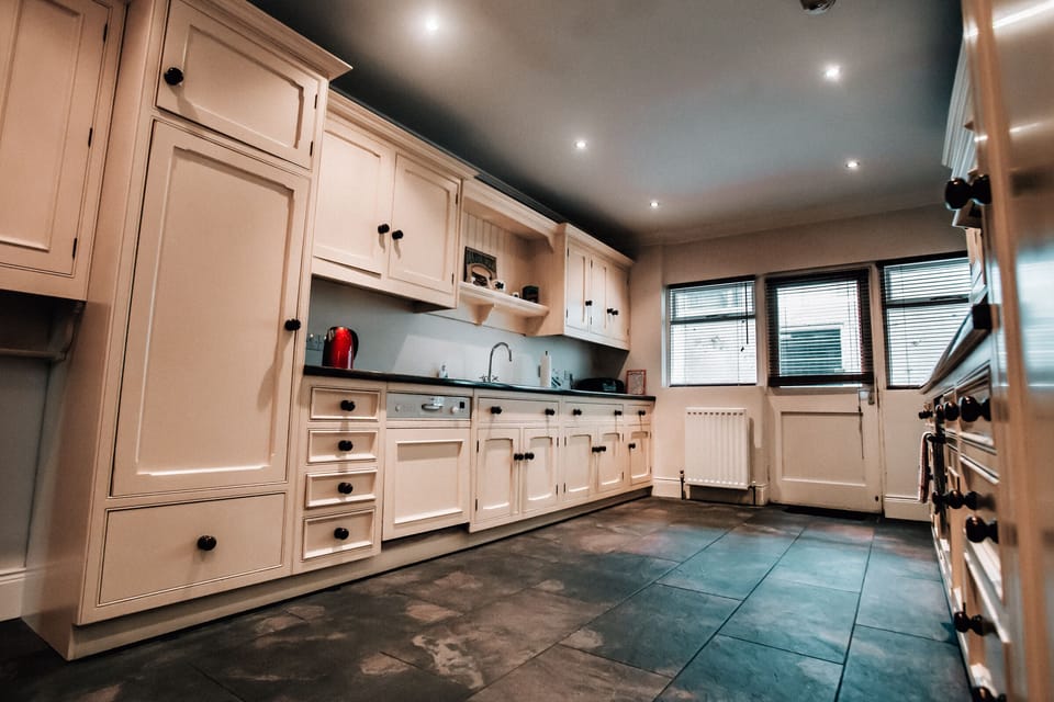 Kitchen area with separate utility room with washer/dryer