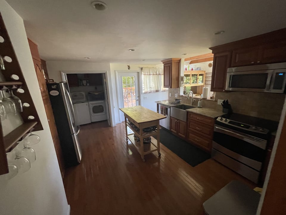 Large kitchen with island, the large deck is just off the kitchen.