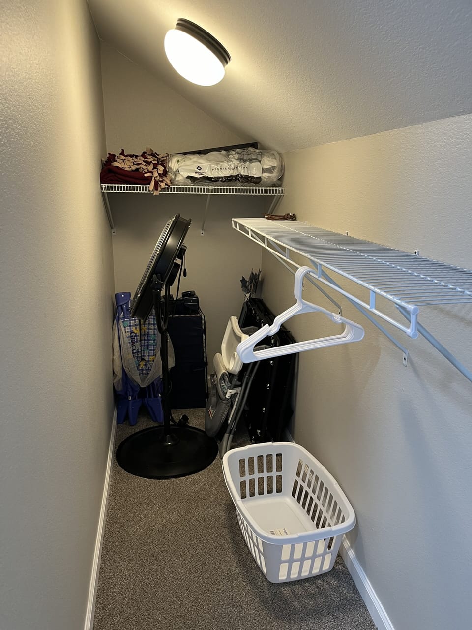 Walk-in closet in master upstairs. 2 pack n plays, high chair, fan for outside