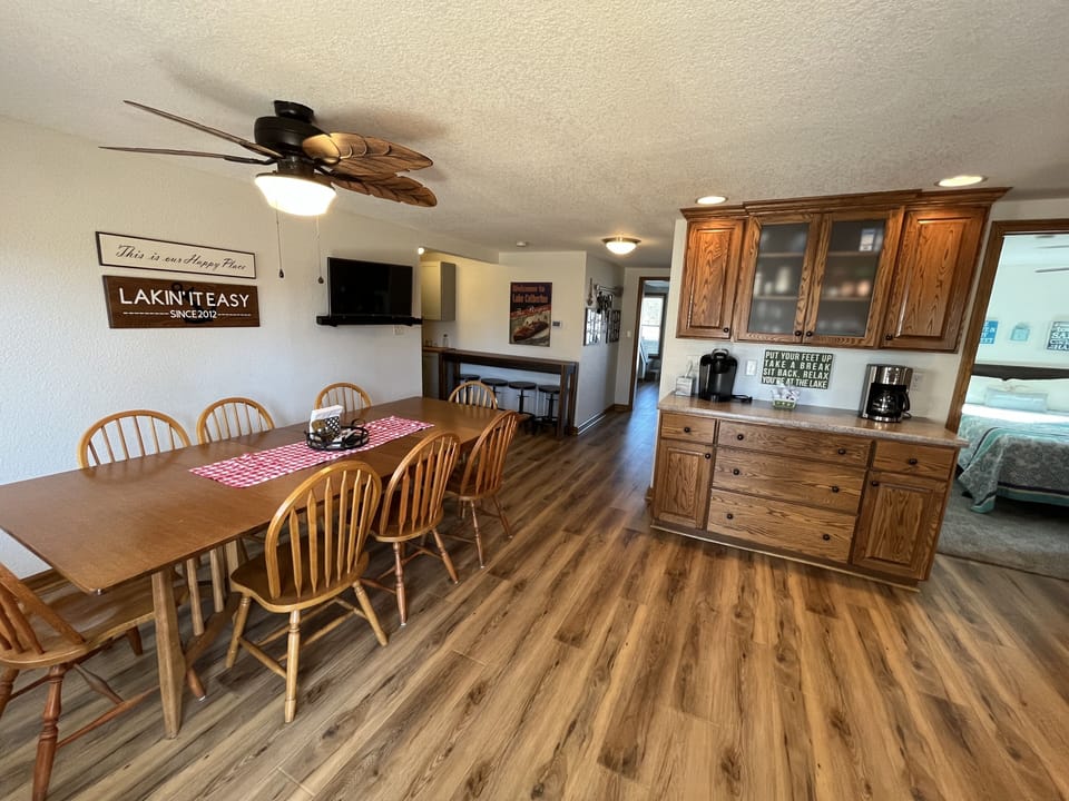Kitchen dining area. More folding chairs in the laundry room.