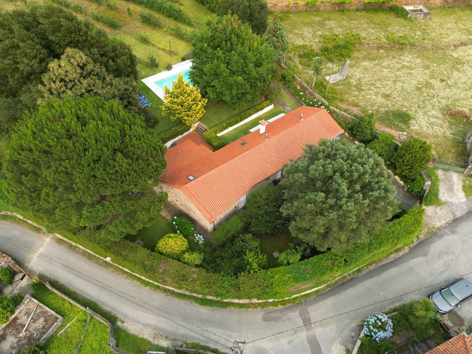 General view of the house. Front garden, pool and rear garden