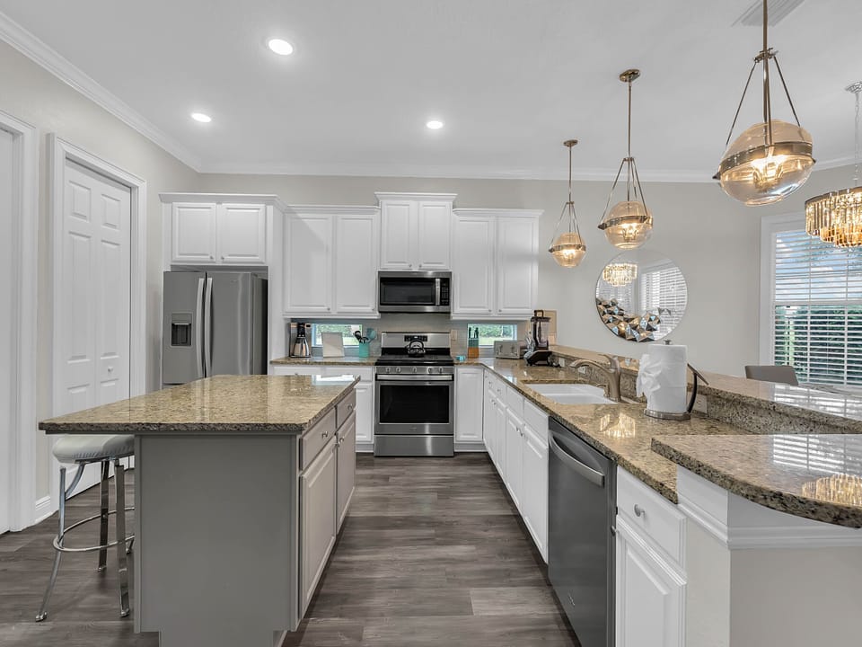 Large fully equipped kitchen with stainless steel appliances