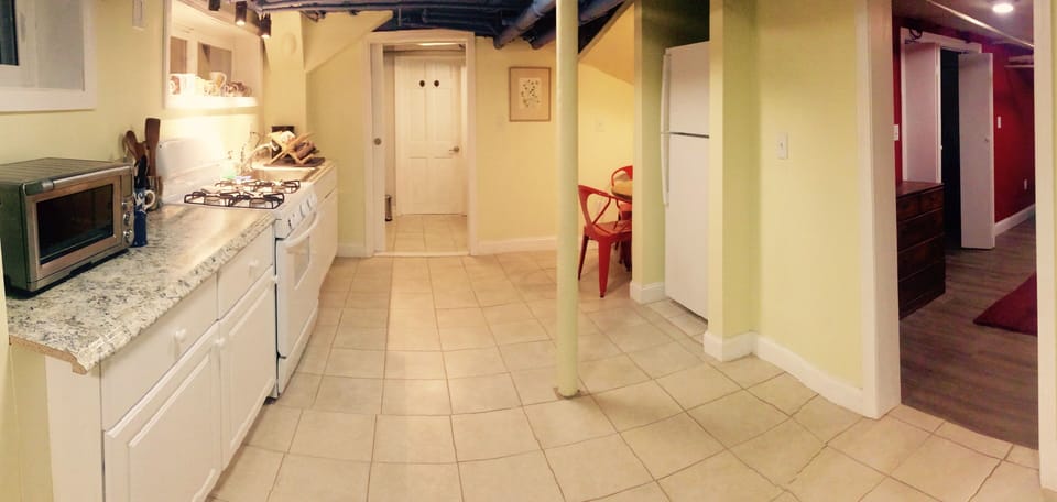Looking from entry area across kitchen to bathroom. 