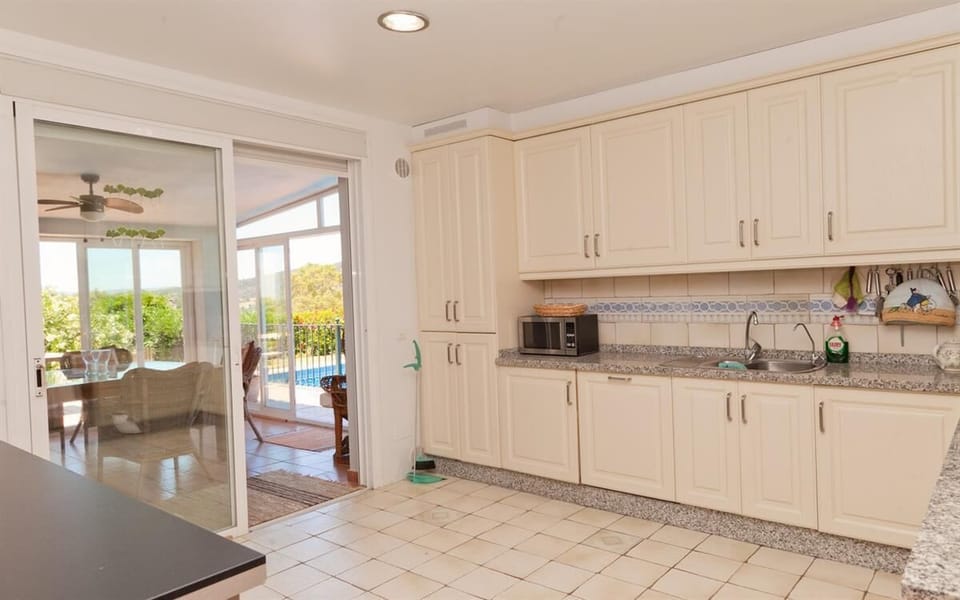 Kitchen from the other side with laundry room