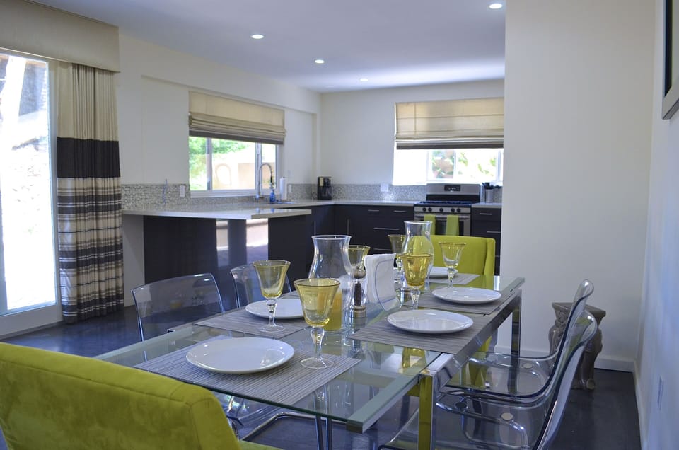 Dining for 6, lucite chairs and modern glass top table