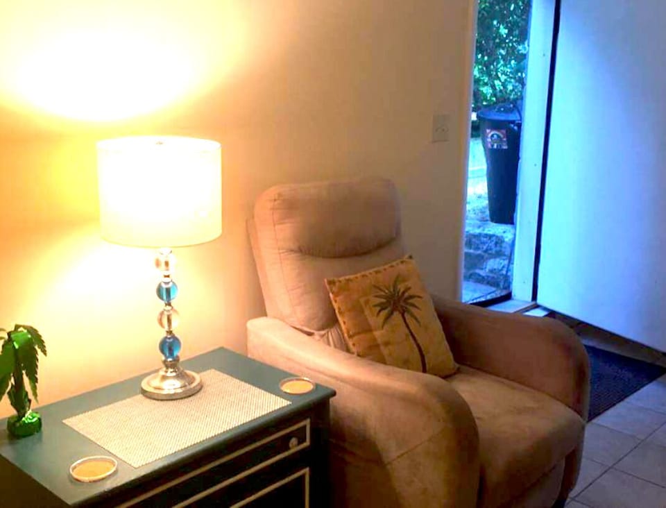 Comfy recliner-small chest of drawers.
