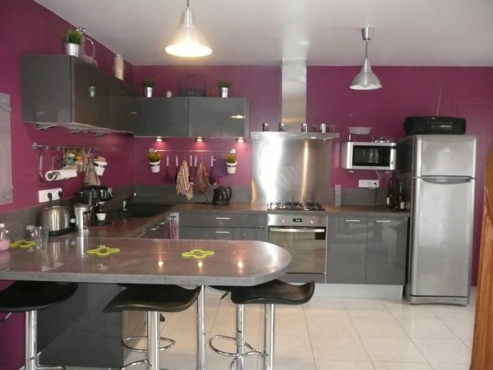 Kitchen opening on a large living room