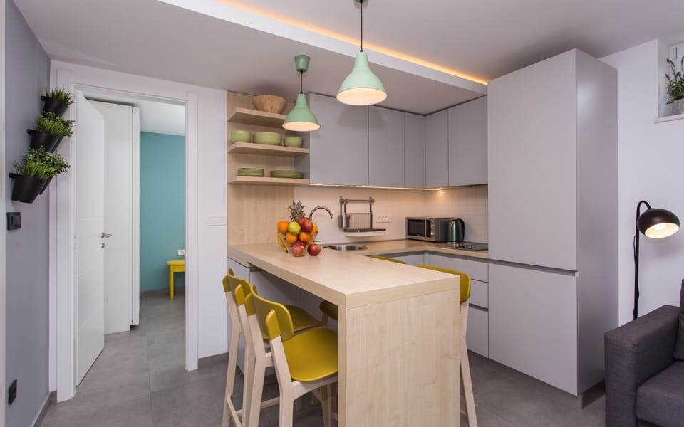 Kitchen and living room are one open space. Kitchen is fully equipped.