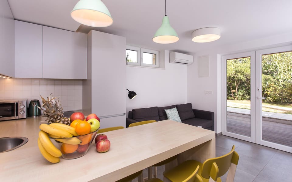 Kitchen and living room are one open space. Kitchen is fully equipped.