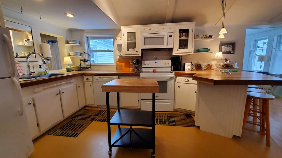 Open living. kitchen, and dining area.