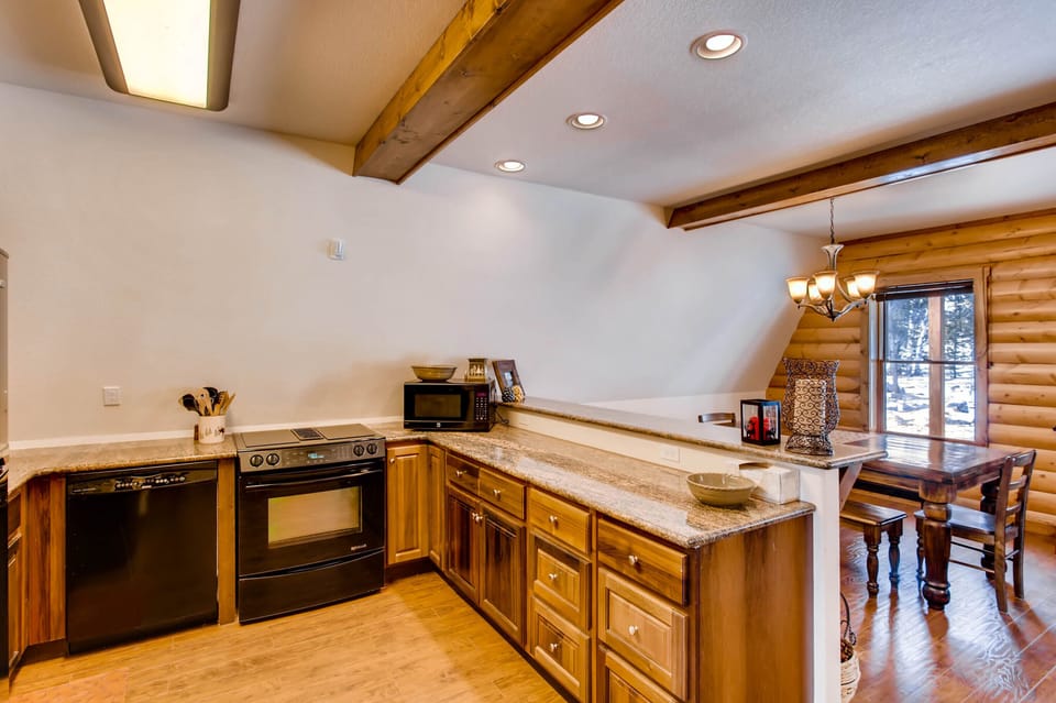 The kitchen has everything you will need for your stay including all dishes, pots and pans, and silverware.