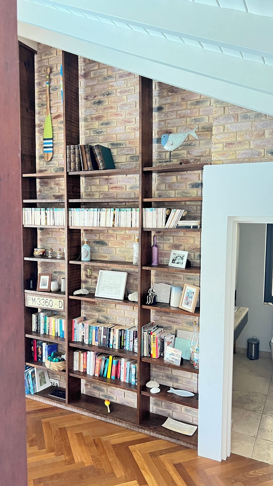 Bookcase stocked with books and games for all to use