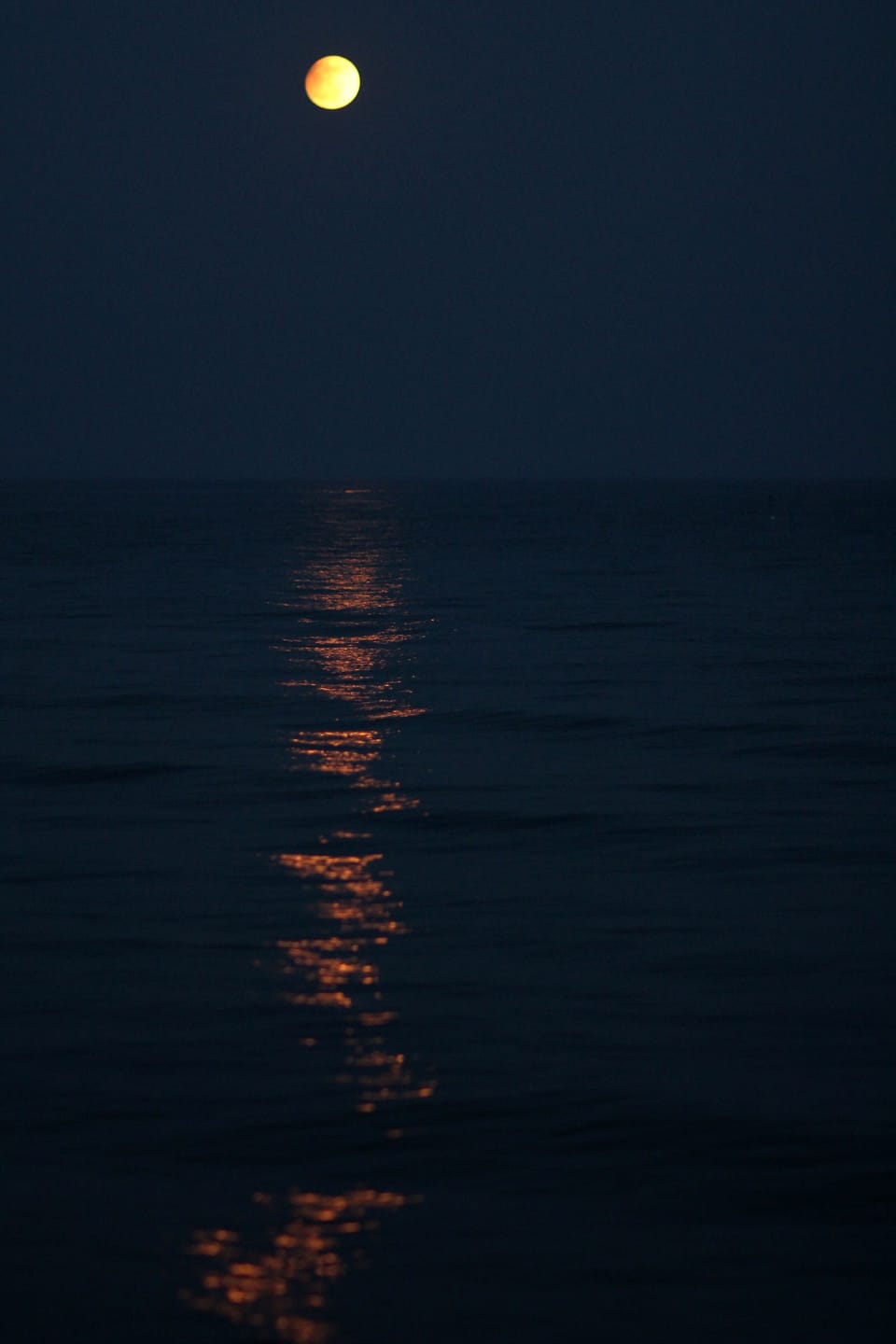 The moon over the sea from the doorway of Seaspray