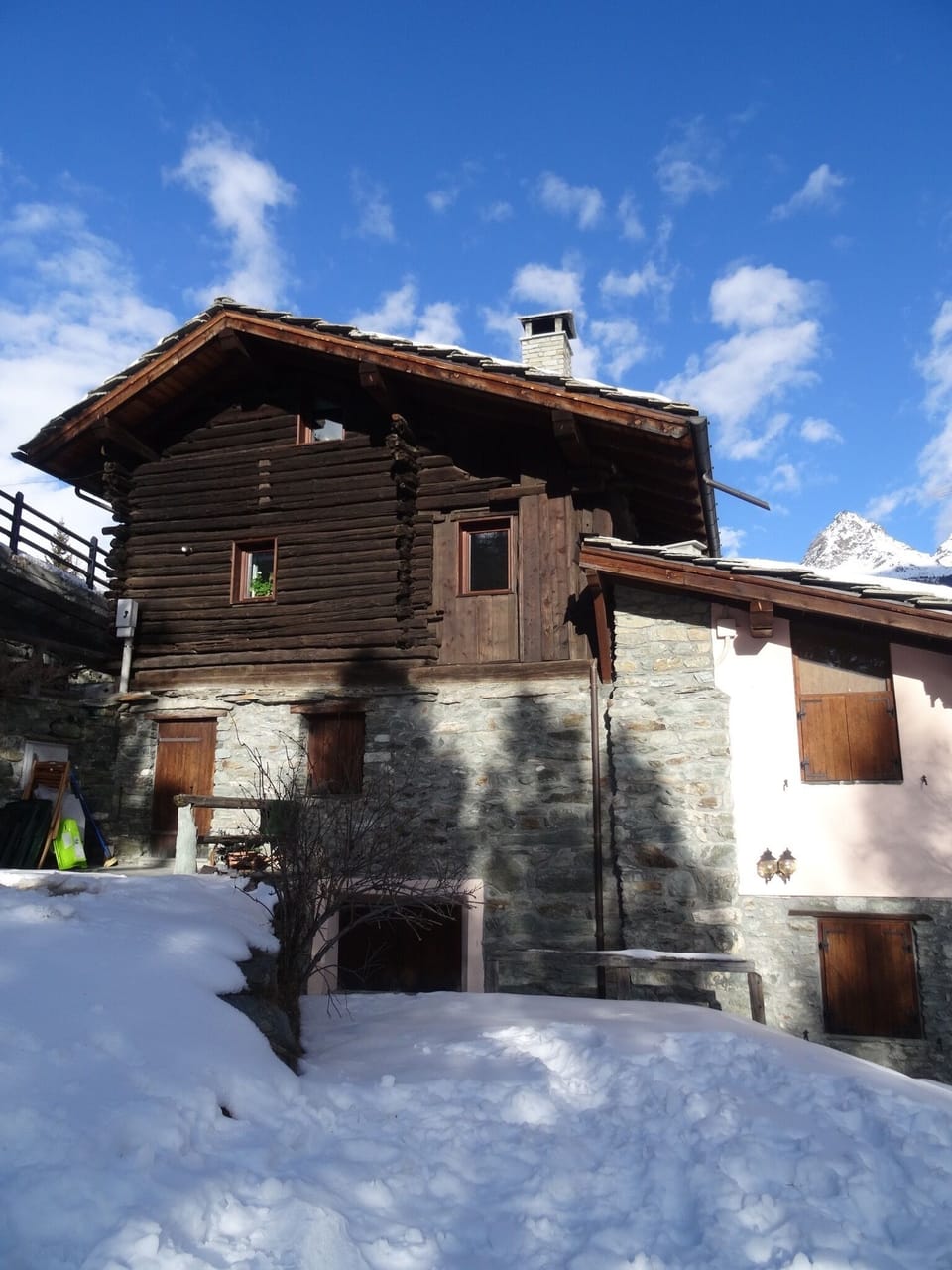 View from the garden. Top two floors (wooden half) is the property.