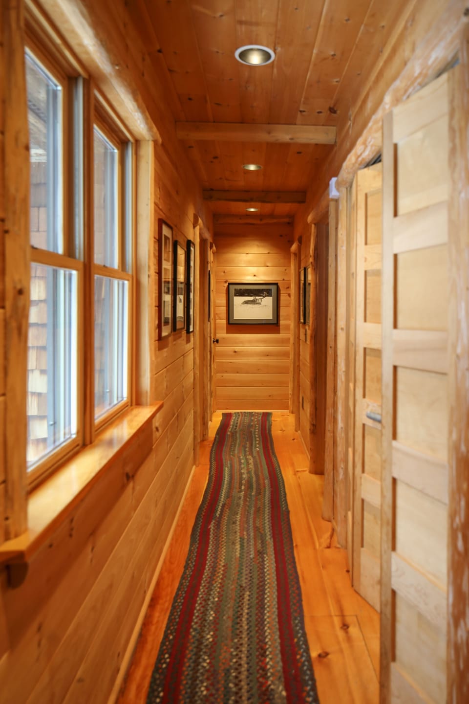 Hallway to two of the master bedrooms and laundry and powder room family photos 
