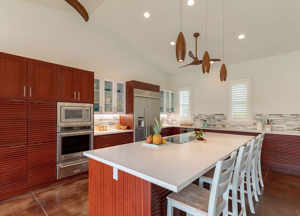 Prepare meals in the fully appointed kitchen with upgraded appliances, generous counter space, and island seating for casual breakfasts.