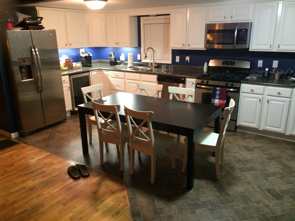 Kitchen with stainless steel appliances and wine refrigerator