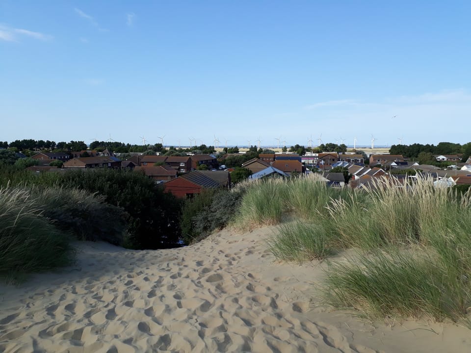 The Seaside House is situated in the road at the bottom of the dunes.