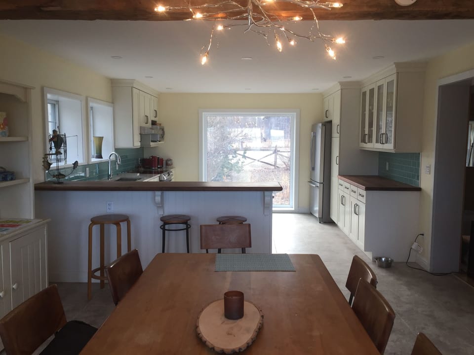 Brand new kitchen with walnut breakfast bar and quartz countertops