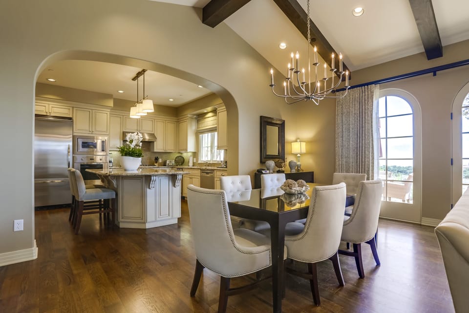 Dining table for 6 with additional bar stool seating at the kitchen island
