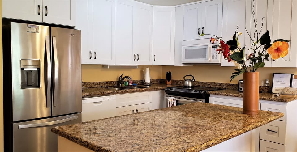 Kitchen with granite counter and new cabinets