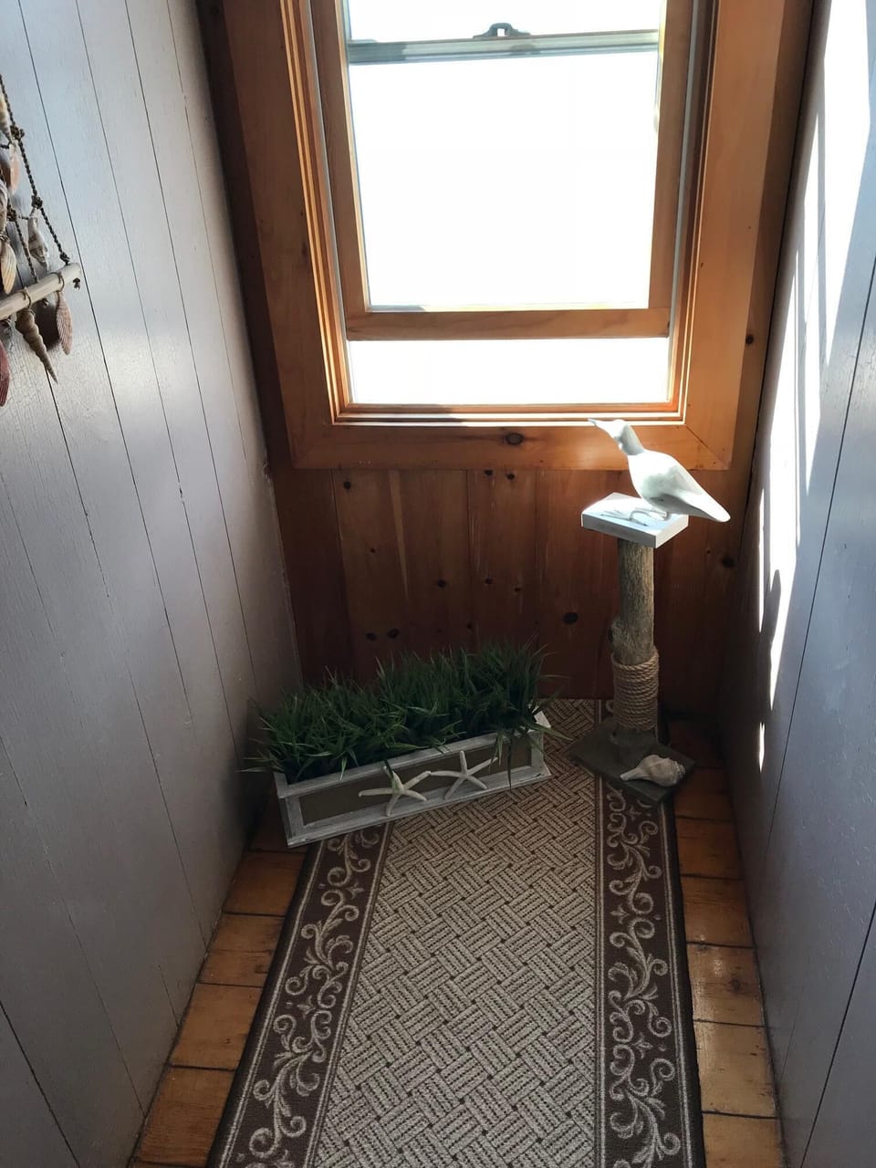 View of ocean at end of hallway