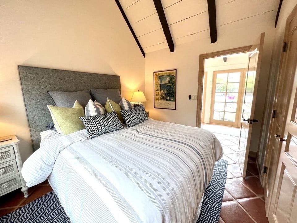 Bedroom #1 with door to attached bathroom. 