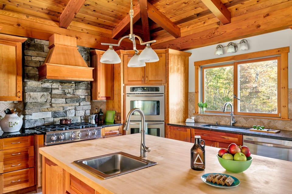 Two ovens, two refrigerators, plate warmer & an enormous butcher block counter.