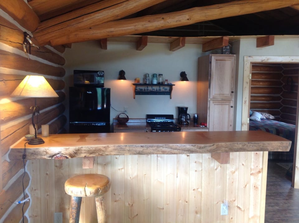 Kitchen bar and look into the full kitchen