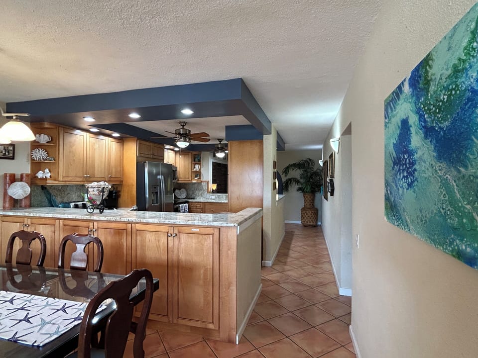Kitchen open to dining, living and entryway