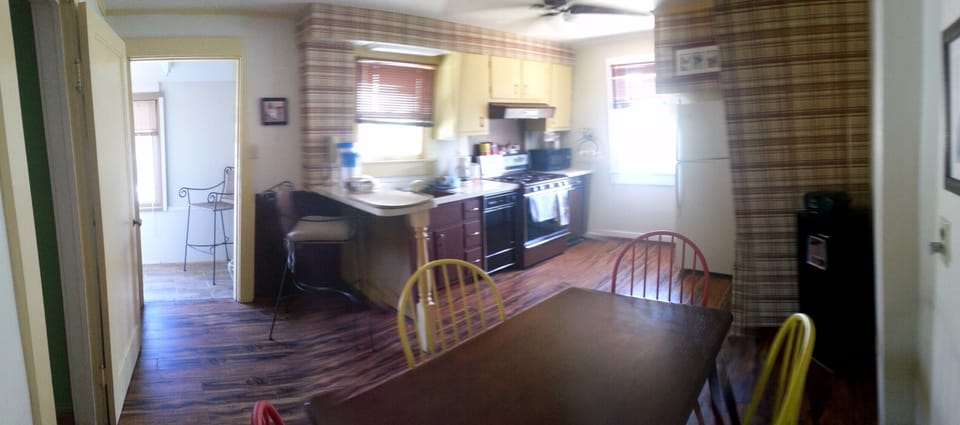 Kitchen looking into tiny porch 