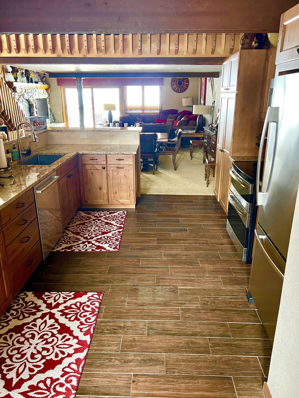 View from back of kitchen shows open floorplan into dining area & family room