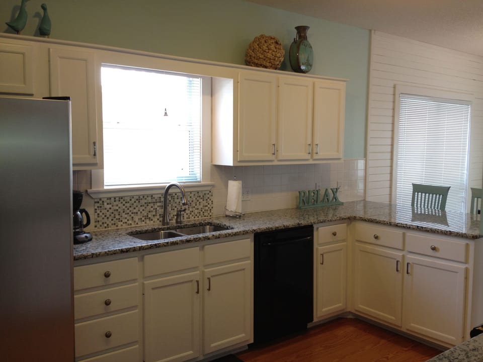 Spacious updated kitchen stocked with all of your baking/cooking needs.