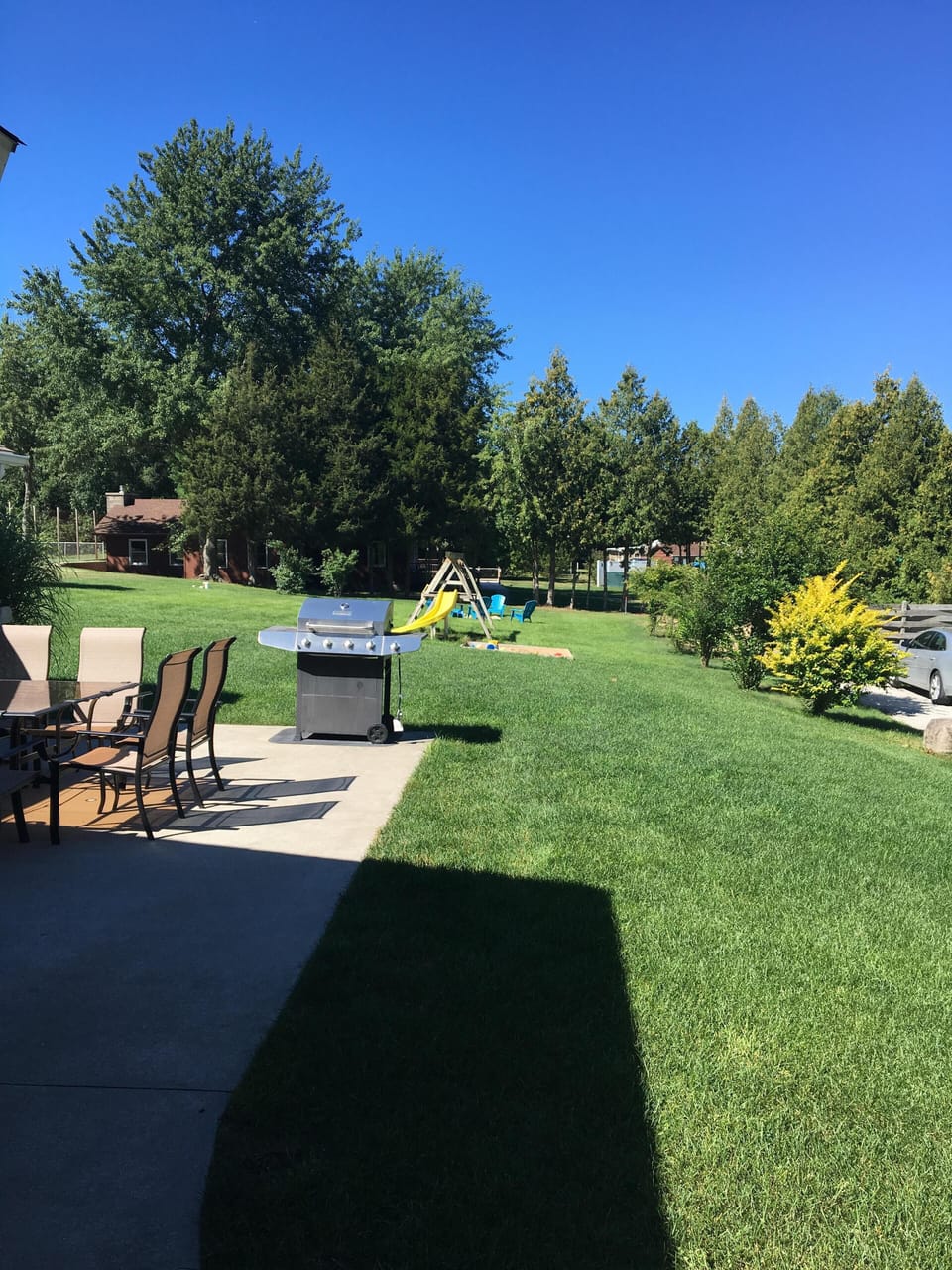 Yard with Pool and Clubhouse just beyond trees