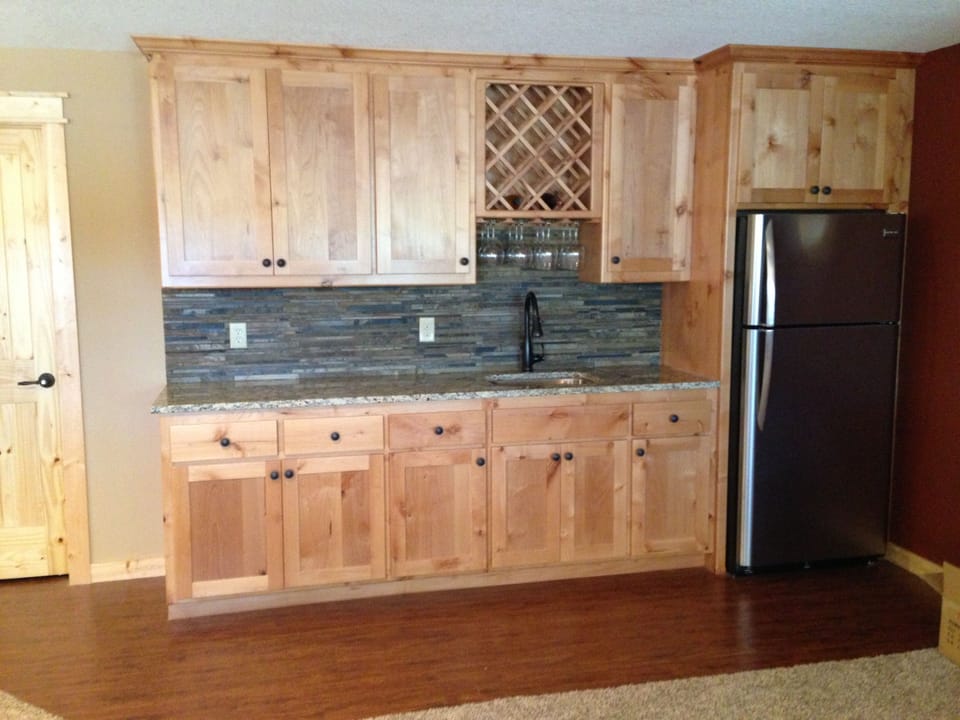 downstairs bar area with full fridge/freezer for extra storage
