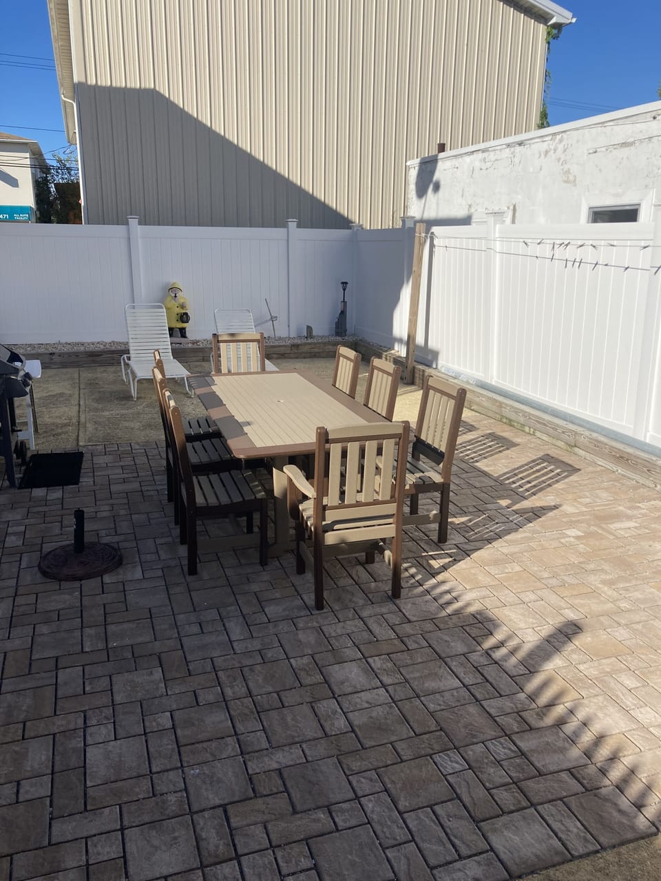 Weber gas grill. New Amish  poly wood picnic table seats eight people. 