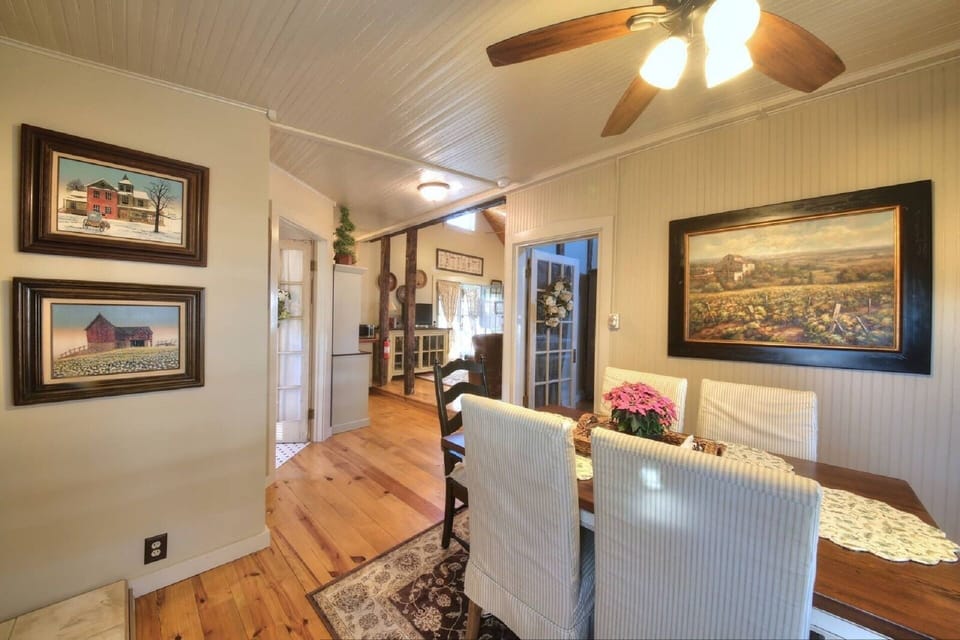 Dining area with fireplace and flat screen TV.