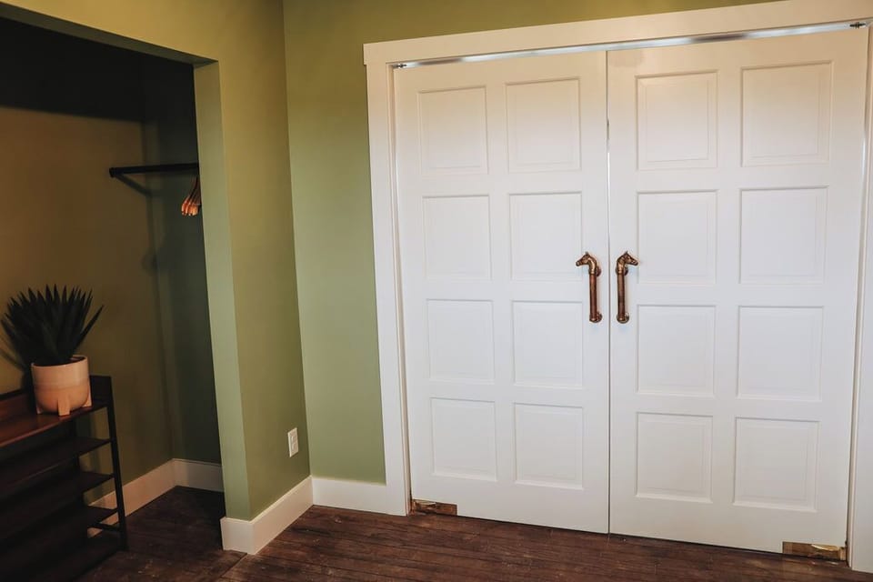 Double doors that close off the entry way from the living room.