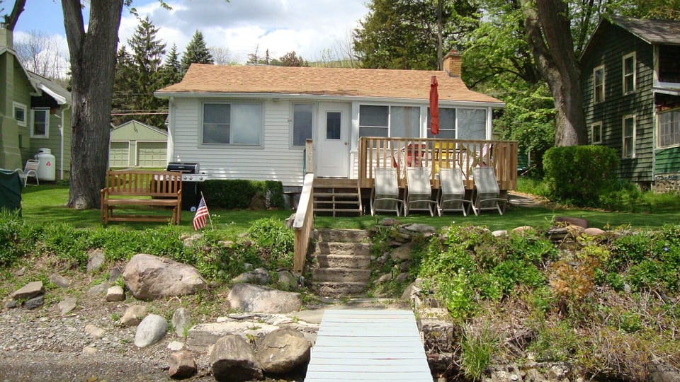 Sunny or shaded sitting areas.  Fire pit.  New handrail along steps to dock.