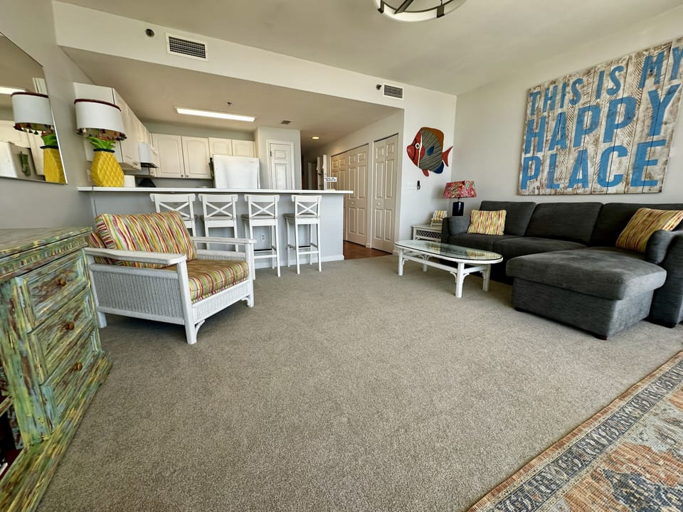 Living room and kitchen. Seating for 4 at the counter.
