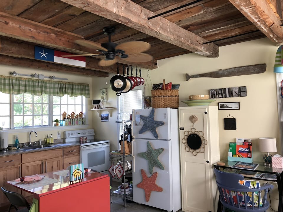 Kitchen Area with dining table (can open to seat more) small pantry for drygoods