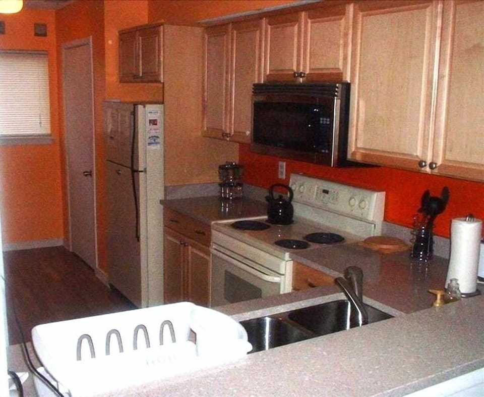 View of the roomy kitchen through the breakfast bar
