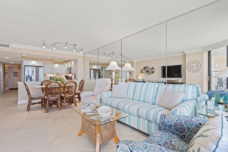 The full mirrored wall  in the Living Room provides panoramic ocean views.
