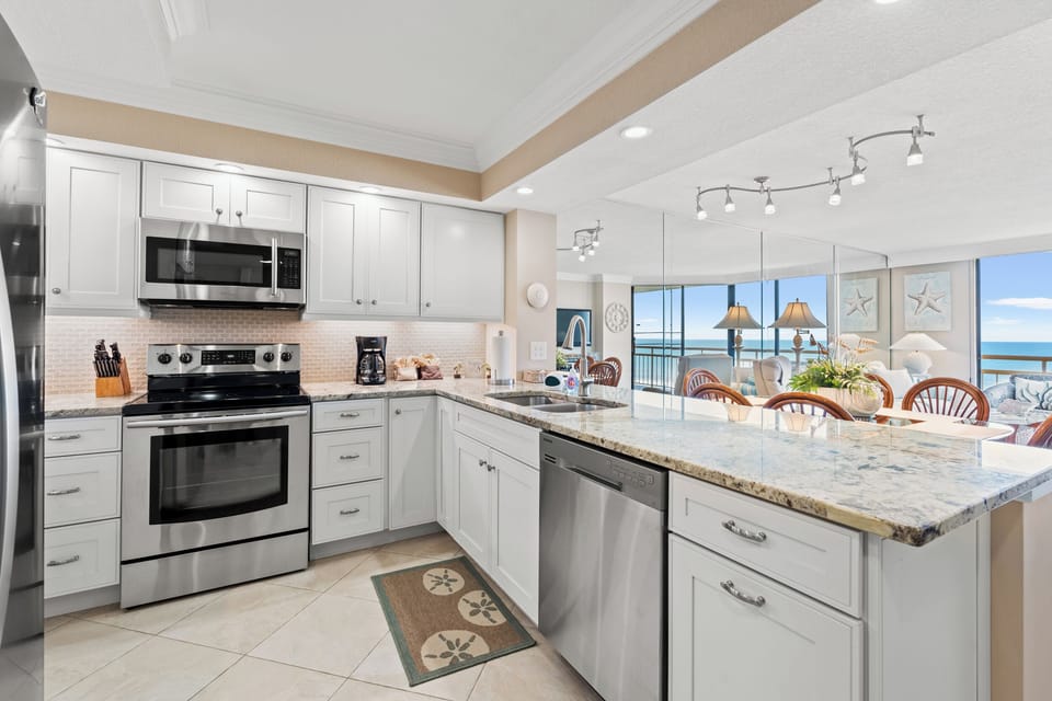 Kitchen is fully stocked and features an exotic granite countertop from italy.