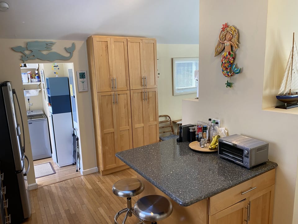 Kitchen island provides a convenient dining spot for two.