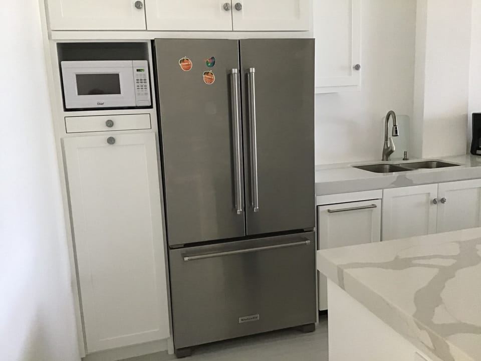 Fridge with ice maker.  Bosch dishwasher.  Blanco double sink. Pull out pantry.