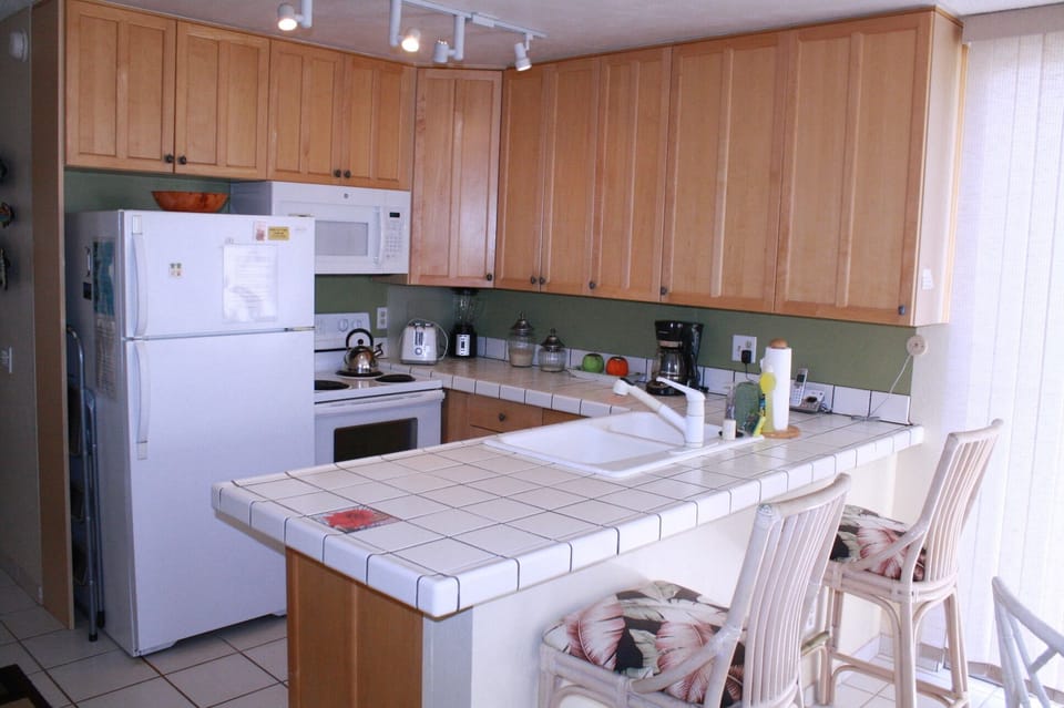 Nicely updated and well stocked kitchen. $ave when eating in on Island.