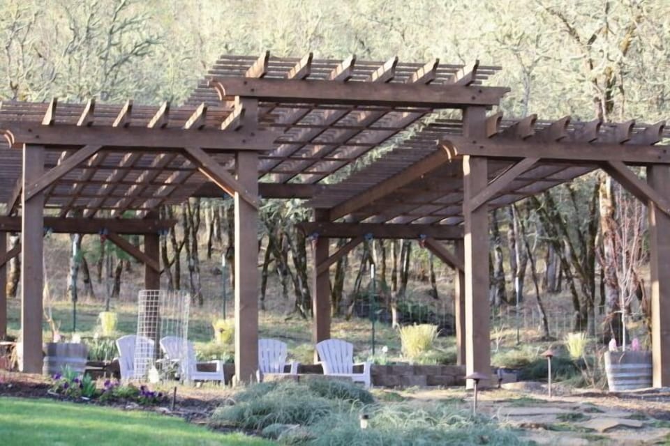 pergola with large paver patio and firepit